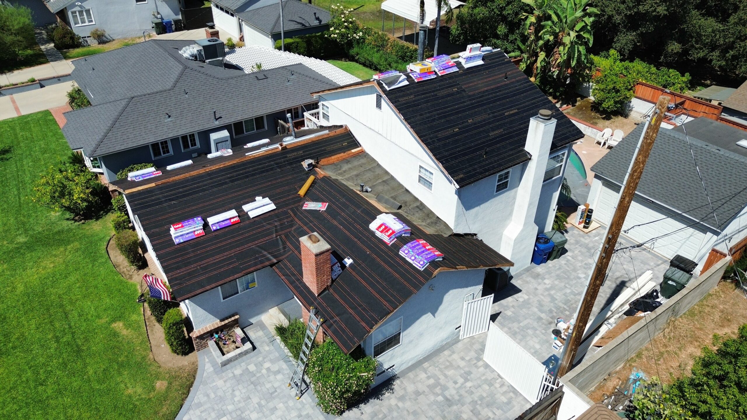 Aerial view of roofing materials staged for a re-roof