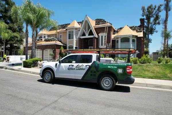 Green Ladder Roofing work truck on a Pasadena job site